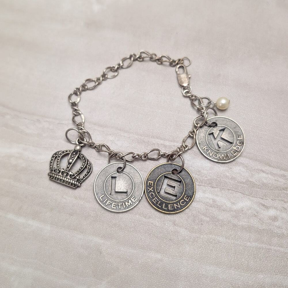 Silver Tone Charm Bracelet with Lifetime Excellence Knowledge & Crown Charms
